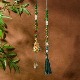 Green gourd beaded pendant with auspicious charms