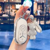 L-shaped, diamond-encrusted milky white with silver trim + diamond-encrusted teddy bear.