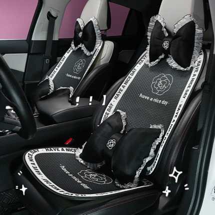 Elegant black honeycomb camellia car cushion set with fringed bows, featuring have a nice day text and non-slip design for en...