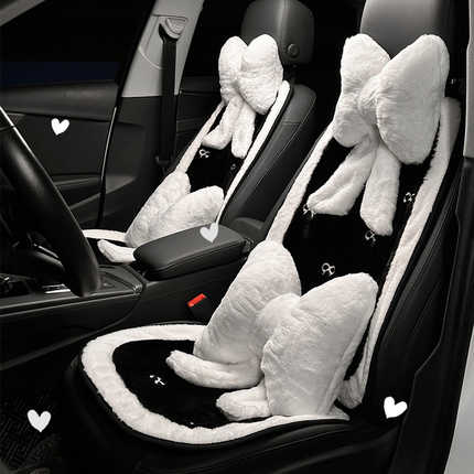 Cozy bow plush car seat cushion with soft white accents, perfect for a warm and goddess-like ride.