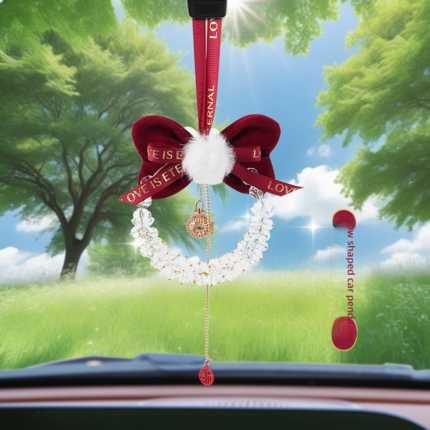 Elegant red bow crystal car pendant with fluffy charm, perfect for girls cars, featuring a crescent design and love ribbon.