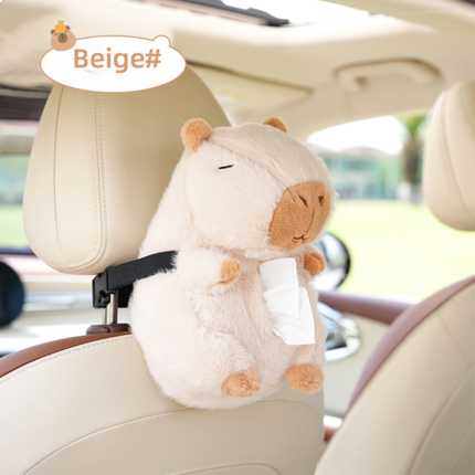 Cute beige capybara plush car tissue box holder attached to a seatback, featuring soft fabric and a convenient tissue slot fo...
