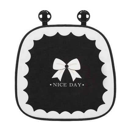 Black and white goddess bow winter cushion with plush texture, featuring a bow design and nice day text for cozy comfort.