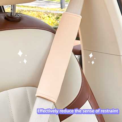 Universal seat belt shoulder protector in beige, designed to reduce restraint and enhance comfort on car seats.