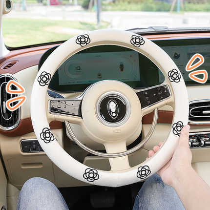 Cute cartoon steering wheel cover with floral patterns, providing a breathable and all-season grip for your cars interior.