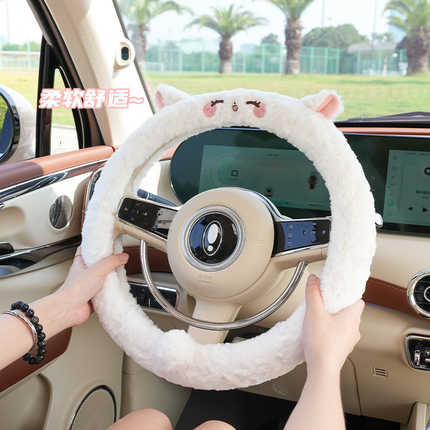 Cozy sheep plush steering wheel cover with cute ears, providing warmth and a soft grip for winter driving comfort.