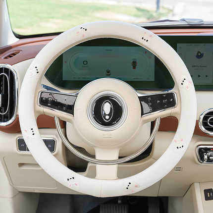 Cotton-linen steering wheel cover with cute cartoon design, offering a non-slip grip for enhanced driving comfort and style.