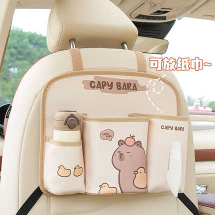 Cute capybara-themed leather car seat back organizer bag with pockets for storage and a tissue holder, perfect for keeping es...