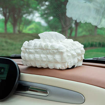 Elegant puff-shaped car tissue box with quilted design, perfect for armrest or visor storage in any vehicle.