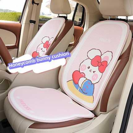 Cute bunny-themed honeycomb car seat cushion with breathable design, featuring a playful cartoon rabbit on soft pink fabric f...