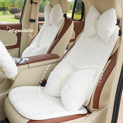 Elegant white plush car seat cushion with bow design, offering cozy warmth and stylish comfort for winter.