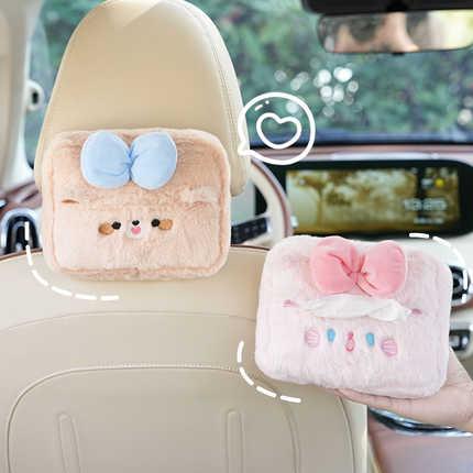 Cute plush cartoon car tissue box holders with adorable bows, designed as hanging armrest accessories for a fun and functiona...