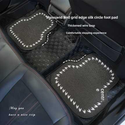 Black houndstooth silk loop car floor mats with diamond grid and white stitching, offering a comfortable stepping experience ...