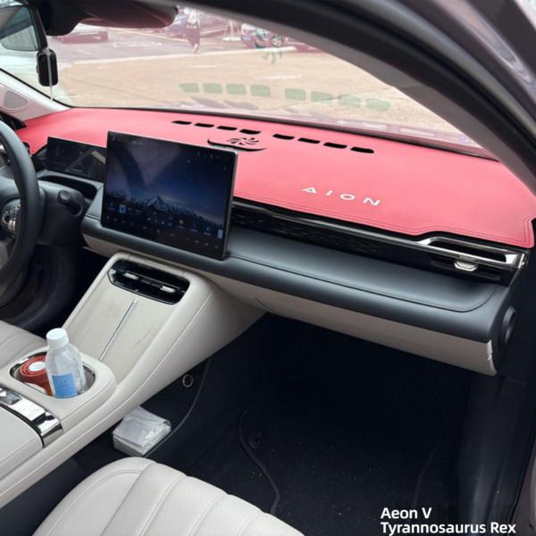 Red gac aion v gen 2 dashboard sun shade cover protects interior, featuring sleek design and brand logo, showcased in a moder...