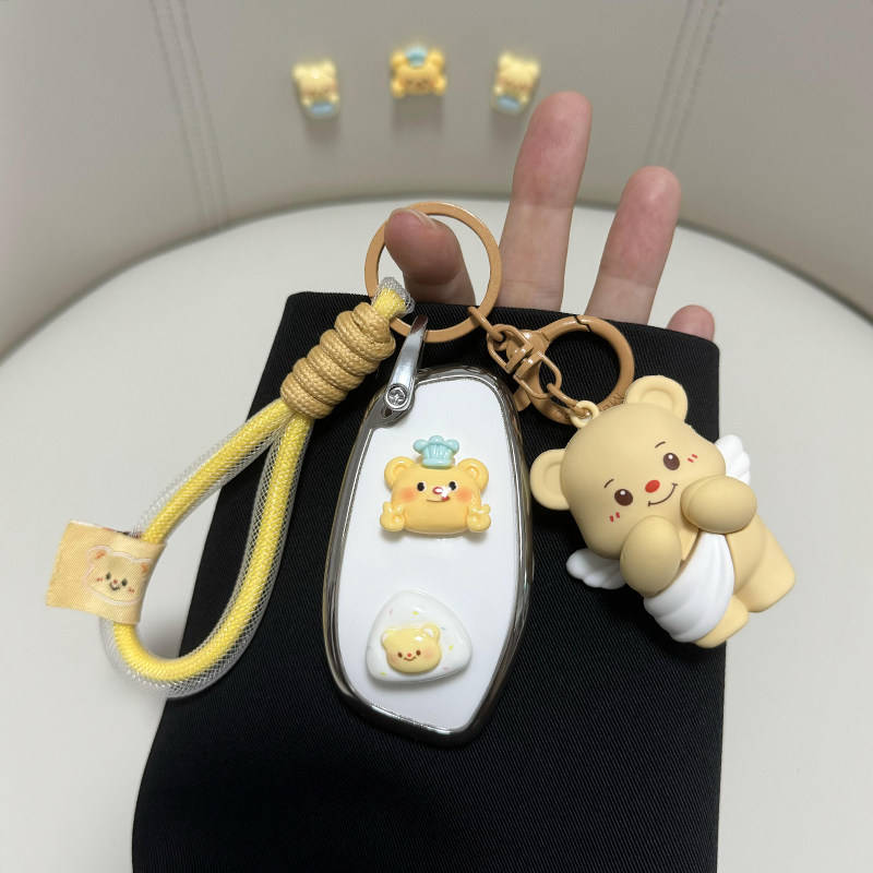 Adorable great wall h6 car key cover featuring a cute teddy bear design with angel wings, paired with a matching keychain and...