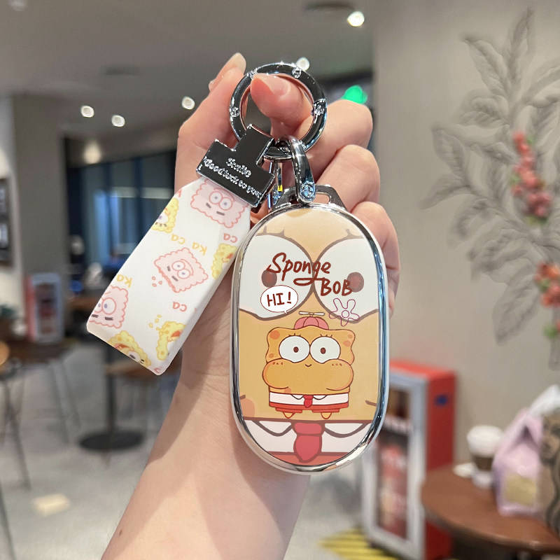 A hand holds a spongebob-themed car key cover for nio et5, es6, ec6, et7, and es8 models, featuring a cheerful design with a ...