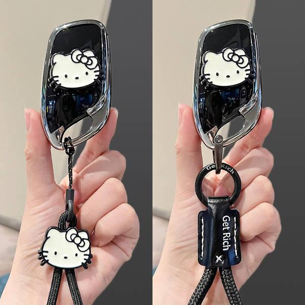 Stylish roewe rx5 plus key cover featuring a hello kitty design, complete with a matching keychain and get rich strap for add...
