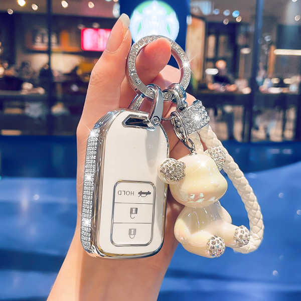 GAC Honda皓影 Key Cover - Luxury & Stylish | Wholesale & Custom - Style I features a diamond-encrusted milky white silver trim, a diamond-encrusted woven cord, and a diamond-encrusted bear.