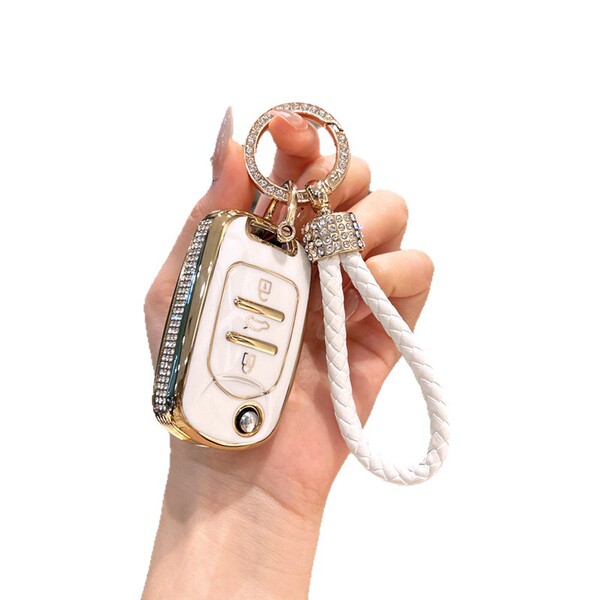 Elegant wuling binguo key cover for mini ev & binguo plus, featuring a white and gold design with diamond accents and a braid...
