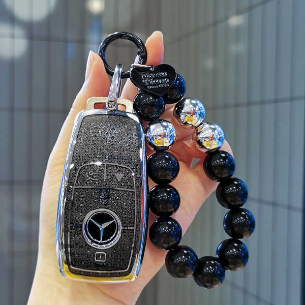 Mercedes GLE450 Key Cover - Durable & Stylish | Wholesale & Custom Logo - Black diamond-colored pearl necklace with a black heart shape (with a silver horseshoe clasp).