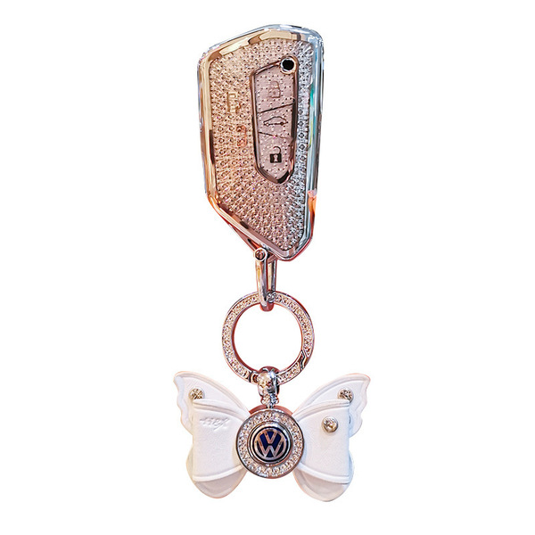 Elegant volkswagen viloran key cover for 2022–2023, featuring a sparkling diamond design and a decorative butterfly charm wit...
