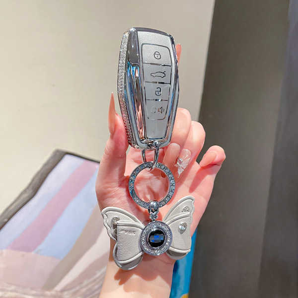 Elegant premium silicone key cover for boyue and geely gl, featuring a butterfly charm and diamond accents, offering stylish ...