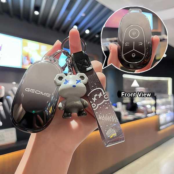 Geely galaxy l7 key cover with a stylish black design and a cute bear charm, shown in front view with detailed button layout.