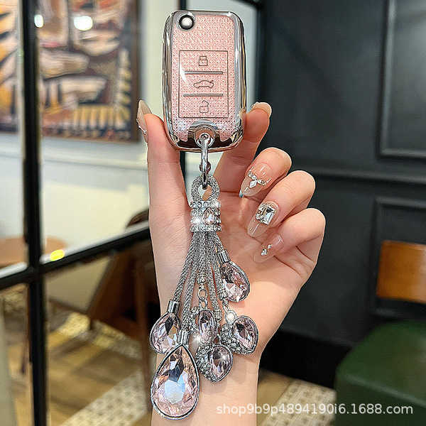 Elegant roewe rx5 key cover with sparkling crystal tassel, designed for women, featuring premium leather and stylish embellis...