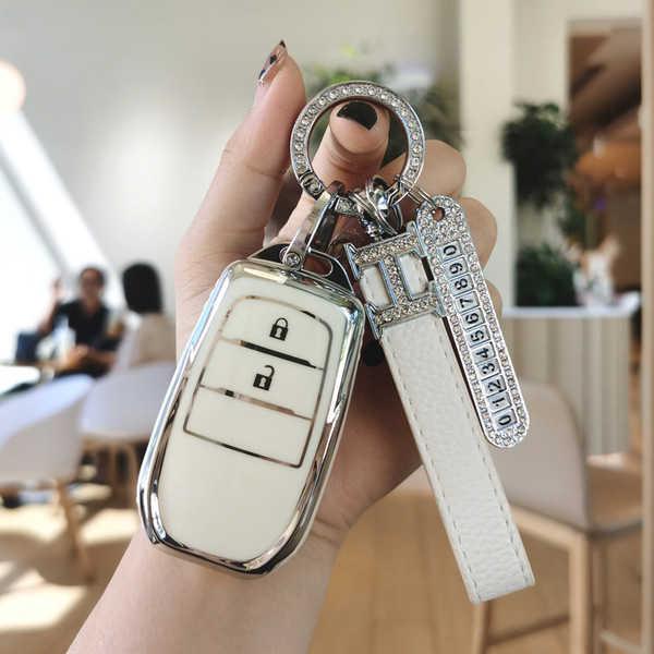 Elegant white toyota key cover for camry, corolla, avalon, rav4, asia, and lion, featuring a sleek design with a diamond-encr...