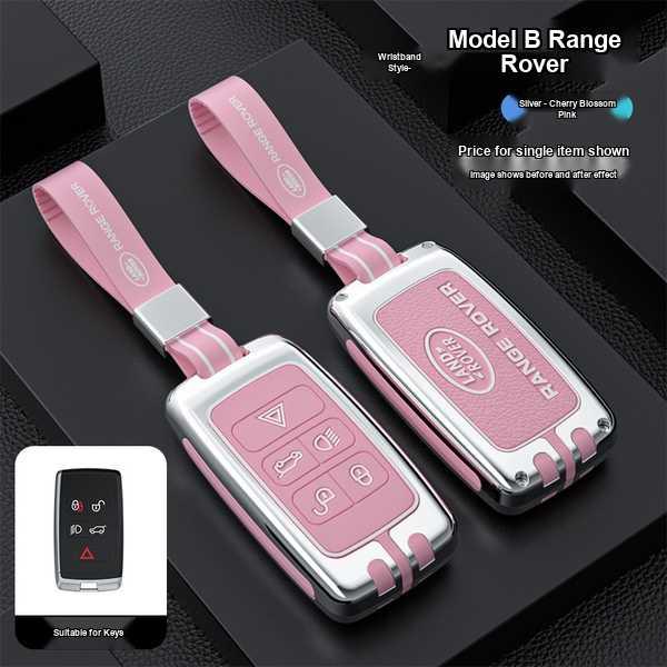 Pink and silver land rover key cover for range rover, defender 110 & discovery, featuring a wristband-style strap and sleek d...