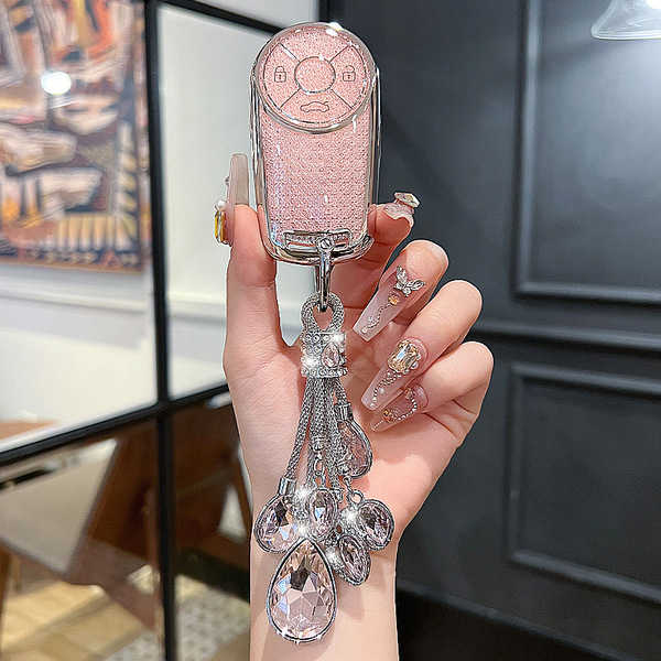 Elegant ora good cat key cover featuring a sparkling pink design with crystal embellishments, perfect for enhancing the style...