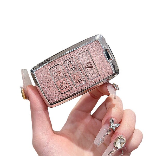 Elegant pink land rover key cover for range rover sport, velar, and defender, featuring a sleek design with protective button...
