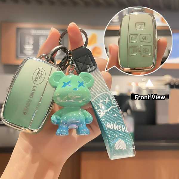 Land rover key cover for range rover evoque and defender 110, featuring a stylish green design with a bear charm and front vi...