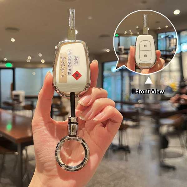 A hand holds a stylish dongfeng renault key cover for models like koleos and captur, featuring a sleek design with a decorati...