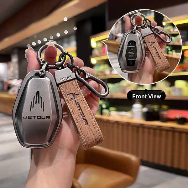 Jetour x70 plus key cover 2023: sleek metallic design with leather strap, front view showcasing buttons and logo.