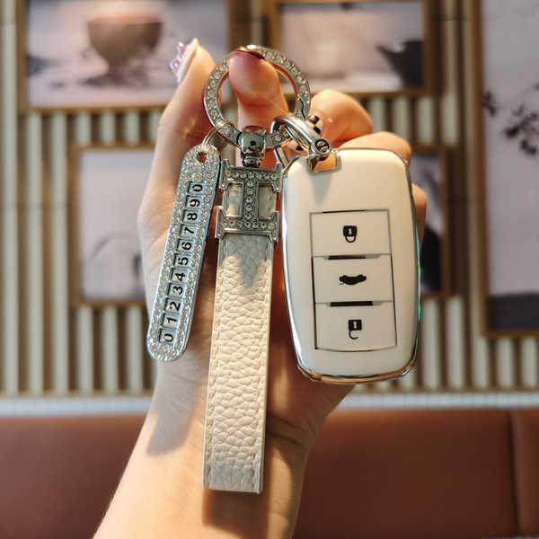 Elegant changan cs75 key cover with a premium pu leather strap and decorative ring, featuring a sleek design and functional b...