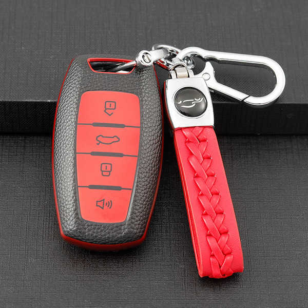 Protect your haval key with a sleek black and red leather-style cover, featuring a braided red strap and durable metal clip f...