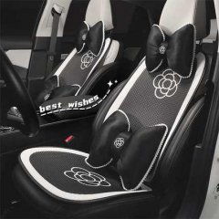 Elegant black and white car seat covers featuring a classic camellia design, offering premium comfort and a non-slip grip for...