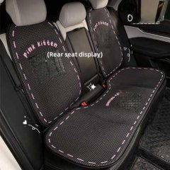 Cartoon cat car seat cushion displayed on rear seats, featuring a black mesh design with pink stitching and pink kitten text ...