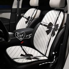Plush bow-tie winter cushion with non-slip design, featuring a stylish black bow and dotted pattern for cozy car seat comfort...