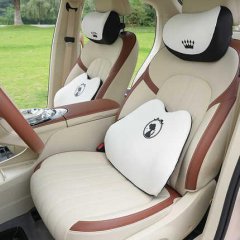 Elegant car seats with goddess ice silk memory foam car headrests, featuring white and brown leather with decorative pillows ...