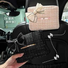 Elegant chanel-style mini car tissue holder with a hanging bow, featuring a black and beige tweed design for stylish in-car c...