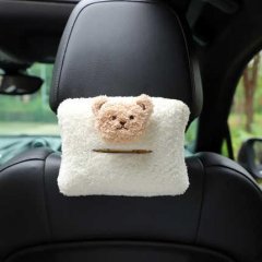 Adorable bear-themed hanging diy tissue box holder for cars, featuring a soft white fabric and a cute teddy bear face design....