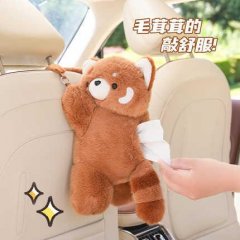 Cute raccoon plush car tissue box holder hanging on a seat back, providing soft and convenient access to tissues while adding...
