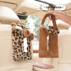 Leopard print plush car tissue box with dual handles, featuring a soft design for easy hanging and convenient use in vehicles...