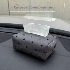 Stylish polka dot car tissue box with hanging bow design, perfect for smooth and elegant tissue extraction in your vehicle.