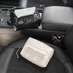 Elegant black and cream leather car tissue box armrest covers, featuring quilted designs for stylish and functional in-car st...
