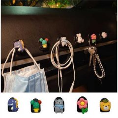 Car cartoon mini hooks: adorable, invisible dashboard hooks holding masks, earphones, and keys with cute designs like dinosau...