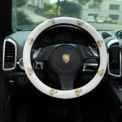 Cotton linen cartoon steering wheel cover with non-slip design, featuring adorable bear patterns on a porsche vehicle.