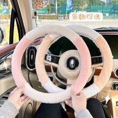 Plush winter steering wheel cover in soft pink and white, providing warmth and antifreeze protection for a cozy drive.
